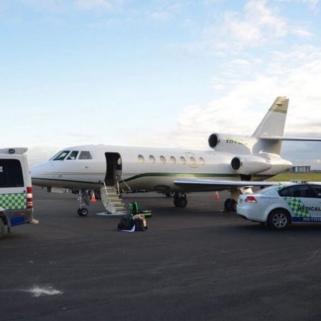 Medical Rescue jet, ambulance and car on runway